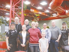 Nouran Abdellatif/Rep Staff
Six City of Leduc employees and one local eight-year-old shaved their heads for the Hair Massacure event on March 23. Saradee staff did the honours at the Civic Centre. 
Front row from left, Saradee stylist and owner Sarah Franks, City of Leduc employees Donna Anstey and Nikki Booth, and Aleah Barron, 8. Back row from left, City of Leduc employees Terry Holte (who's currently battling cancer), Shawn Olson, Bart Pouteau, Sue Armstrong, Sean Haughian and Saradee stylist Shanelle Pratt. The Lockless Leducians team raised more than $5,700 while Aleah raised over $1,500.