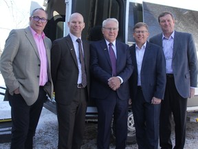 Jamie Lowery, chief executive officer at Cassellholme Home for the Aged, Thomson Financial Partners Rob Fry, Ted Thomson and Chris Winrow and Coun. Mark King pose for a picture in front of an accessible transport bus that was donated to the long-term care facility by Thomson Financial Partners.