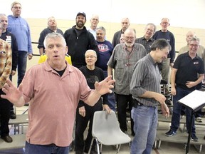 Dr. Phil N. Yankem (Ken Jones) meets members of Northland Barbershop Chorus in a scene from Tony and the Time Machine.