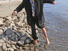 TIM MEEKS/THE INTELLIGENCER
Dave Allen, President and CEO of the YMCA of Central East Ontario, dips his foot in the frigid waters of the Bay of Quinte Thursday to help promote Freezin’ for a Reason April 21 which will launch the 2018 YMCA Belleville Branch Strong KIds Campaign.