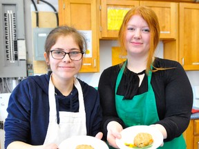 Simcoe Composite School food and culture students Maddi Montour and Ashley Burley showcase some cheddar cricket biscuits baked using cricket powder during class Thursday morning. The group also worked on chocolate chirp cookies using cricket powder and meal worm infused sausage rolls. JACOB ROBINSON/Simcoe Reformer