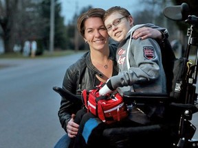 Along with his mom, Tina Boileau, "Butterfly Boy" Jonathan Pitre, now 15, reflects on his eventful year from their home in Russell Tuesday, Dec. 8, 2015. Following a Postmedia piece last year, Jonathan's story of living with EB, went viral and he became the poster boy for the incurable, painful disease. (Julie Oliver / Postmedia)