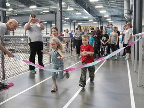 KASSIDY CHRISTENSEN HIGH RIVER TIMES/POSTMEDIA NETWORK. Participants lined up at the streamer start line to kick off the five kilometre Stroller-a-thon.