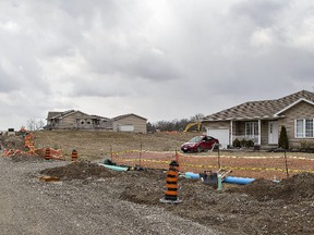 Construction crews for Brantford-based Lanca Contracting are building the first units of a townhouse development on Fourth Line, east of Chiefswood Road, on Six Nations. (Brian Thompson/The Expositor)