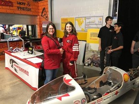 Northern Collegiate Eco-Team co-manger/driver Maria Peregoudov shakes hands with a member of the public at the Sarnia Sting game on March 14. The team unveiled their newly designed vehicle, Rover, at the game.
Handout/Sarnia This Week