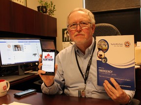 Dave Colvin, Perth County’s emergency management co-ordinator, shows the new Alert Ready logo on his phone on Friday, April 6, 2018 in Stratford, Ont. (Terry Bridge/Stratford Beacon Herald)