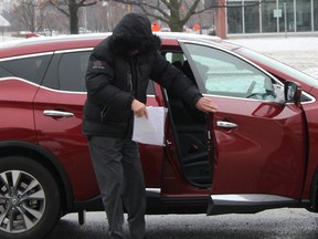 Claude Eric Trachy continued to keep his face hidden from view when arriving at the Chatham Court House in Chatham, Ont. on Friday April 6, 2018 for his trial. The 72-year-old is facing several historic sex-related charges involving 25 female complainants. (Ellwood Shreve/Chatham Daily News)