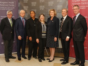 Dr. Helena Jaczek, provincial minister of Health and Long-Term Care, stopped in Kingston on Friday for a tour of Kingston Health Sciences Centre and to talk with staff about how the provincial budget will affect services. Joining Jaczek, third from right, are, from left, Brian Devlin, chair of the Providence Care Hospital board of directors; Paul Huras, CEO of the South East Local Health Integrated Network; Hersh Sehdev, chair of the South East Local Health Integrated Network board of directors; Kingston and the Islands MPP Sophie Kiwala; David Pichora, president and CEO of Kingston General Hospital; and David O’Toole, chair of the Kingston Health Sciences Centre board. (Julia McKay/The Whig-Standard)