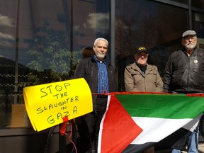 The Chatham-Kent Peace Coalition held protests in Chatham and Leamington on Saturday to show solidarity for Palestinians. From left are Ahmad Elhussein, Dave Hebblethwaite and Derry McKeever, shown at the Chatham-Kent Civic Centre. (Trevor Terfloth/The Daily News)
