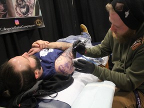 Andrew Toni gets a tattoo featuring Marvel Comics characters including Thor, The Incredible Hulk and Surtur during the first Twin City Tattoo Convention at The Tech on Saturday. Jake Macqueen, of Collingwood Tattoo Company, estimated he'd need 14 hours over two days to finish Toni's tattoo. “It's a reminder that no matter how scary the stuff you're facing, there's always a way you can beat it,” said Toni of his latest tattoo. He has about a dozen. Convention co-ordinator Blayn Morley estimated more than 400 attended as of Saturday afternoon. “It's been steady all day,” he said. Morley marketed the event to more than 60 tattoo shops from Thunder Bay to North Bay and south to Michigan. Six shops were in competition at the Sault Ste. Marie event. Morley wants that number to grow to 20 in three to four years. “It's really amazing the kind of artwork out there,” he said. The convention wrapped Sunday.