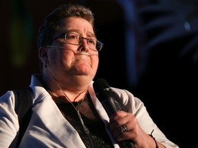 Nancy Trider, breathing with the assistance of an oxygen tank, speaks to a crowd of people during the Hospice Quinte Gala held at the Belleville Armouries on Saturday April 7, 2018 in Belleville, Ont. Trider recounted how she became extremely ill in 2016 and how much hospice helped her get through those tough times. Tim Miller/Belleville Intelligencer/Postmedia Network