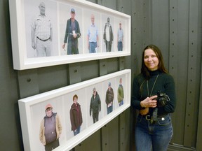 Toronto-based photographer Lisa Murzin in the Legacy Gallery at the Owen Sound Artists' Co-op with some of those featured in her show, Harry Was a Cow Caller. The show runs at the gallery for the month of April. (Rob Gowan The Sun Times)