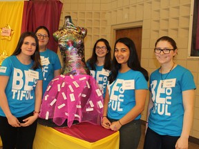 Members of the student steering committee who helped organize the Soroptimist Grand ErieâÄôs Dream It Be It Secondary School Girls Conference include October Cooper (left), Harmony Barnes, Amanda Johnson, Madhu Tiwari and Sarah Spencer. They are gathered around artwork that has positive messages written by event participants attached to it.
Michelle Ruby/The Expositor