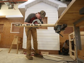 Ernestown Secondary School student Christopher McCulloch works on a dog house during the carpentry competition at the 2018 Skills Ontario Qualifying Competitions, held at St. Lawrence College on April 7.