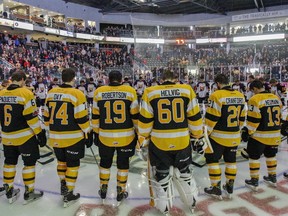 JULIA MCKAY/The Whig-Standard
Kingston Frontenacs and Barrie Colts players, along with the on-ice officials, encircle centre ice with their heads bowed for a moment of silence in honour of the players, families and staff of the Humboldt Broncos junior hockey team, before the Ontario Hockey League Eastern Conference semifinal game at the Rogers K-Rock Centre on Sunday night. A fatal bus crash in Saskatchewan on Friday night left 15 of the 29 passengers on the Broncos’ team bus dead, and the other 14 injured.