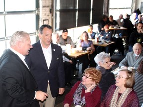 Ontario PC party leader Doug Ford accompanied by candidate for MPP of Kenora-Rainy River Greg Rickford greet with supporters during a lunch hour rally at the Lake of the Woods Brewing Company restaurant in Kenora on Monday, April 9. 
Reg Clayton/Daily Miner and News
