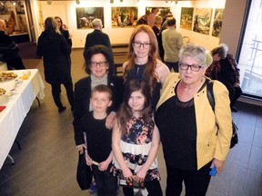 Artist Phyliss Burrell-Elyk (Left) is joined by granddaughter Kristin Sundell, great grandchildren Danika, 10, and Lukas, 8, and daughter Mikki Spafford for a four generation photo. The family travelled  from Thunder Bay to attend the opening night reception for the Journeys with My Grandmother exhibit now on display at Lake of the Woods Museum until April 28.
Reg Clayton/for The Enterprise