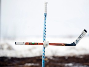 Jonathan Hayward/THE CANADIAN PRESS: 
A cross made out of hockey sticks is seen at the intersection of a fatal bus crash near Tisdale, Sask., Monday, April, 9, 2018. A bus carrying the Humboldt Broncos hockey team crashed into a truck en route to Nipawin for a game Friday night killing 15 and sending over a dozen more to the hospital.