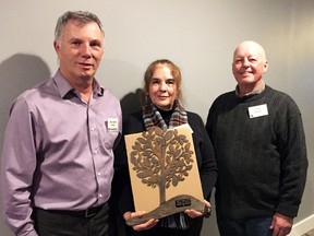 Sydenham Field Naturalists president Dave Smith, left, presents a Friends of Nature Award to Greg and Jill Cadotte at the Sydenham Field Naturalists annual meeting held at Country View Golf Course on April 4. The Cadottes received the award for their efforts in improving their 43-acre wetlands near Mitchell's Bay. David Gough/Postmedia Network