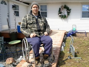 Shawn Daley, of Gregory Line just outside of Chatham, is shown beside the spot where his ATV was parked. It was stolen from his driveway overnight on Easter Sunday. Trevor Terfloth/Postmedia Network