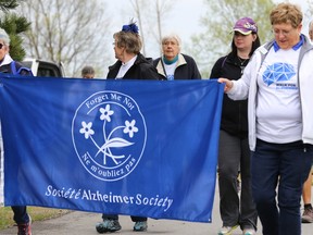 Intelligencer file photo
Walkers hold up a banner during the Quinte West Walk for Alzheimer’s at Centennial Park on Saturday May 13, 2017 in Trenton. The walk is an annual fundraiser for the Alzheimer Society of Hastings-Prince Edward and three local walks will be held in May.