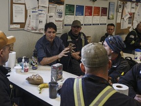 Prime Minister Justin Trudeau meets with workers at Suncor's Fort Hills facility near Fort McMurray.