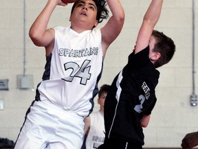 Julio Asuna of the North Bay Spartans U14 boys basketball team goes up against a Sudbury Jam player during exhibition action in the Chippewa Secondary School gym, Sunday. The two teams are getting ready for their provincial OBA championships in London, ON April 20-22. Dave Dale / The Nugget