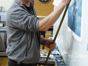 Brian Hohner in his studio demonstrating how he did the Canso painting