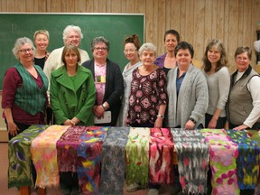 Felting workshop participants and instructor Cheryl Peebles pose with the felted scarves they created in the felting workshop at the Fairview Fine Arts Centre