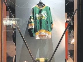 A Humboldt Broncos sweater hangs in the window of Stonewaters Home Elements in Canmore on Monday, April 9, 2018. Spencer Van Dyk/ Bow Valley Crag & Canyon/ Postmedia Network