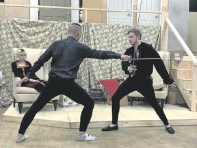 Chris Yee, left, playing the character John Barrymore, spars with Marcus Williams, playing Andrew, while Emma Schneider, playing Deirdre, looks on at a rehearsal for Pine Tree Players’ Spring production of “I Hate Hamlet.” The production runs April 18-28, 2018. Spencer Van Dyk/ Bow Valley Crag & Canyon/ Postmedia Network