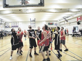 Players from both teams follow the ball during the Bow Valley Basketball league championship game played on Saturday, April 7, 2018. Rose & Crown, wearing black jerseys that say Boston Pizza as a throwback to the previous five league titles won by the team, defeated the Banff Brew Pub 91-60 to win its sixth title in seven years. Russ Ullyot/ Crag & Canyon/ Postmedia Network
