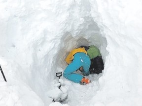 Digging out a buried skier after an avalanche at Sentinel Pass in the Lake Louise area of Banff National Park on Thursday, April 5, 2018. Photo courtesy of Tim Banfield