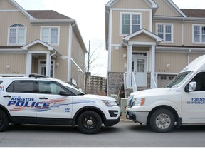 Police outside of a residence on Newmarket Lane where they say two males attacked a resident there early Tuesday morning.  Photo by Jonathan Ludlow for the Whig-Standard