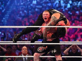 Ricky Havlik/SLAM! Wrestling
WWE Universal Champion Brock Lesnar delivers an F5 to Roman Reigns in the main event of WrestleMania 34 at the Superdome in New Orleans on Sunday. Lesnar retained his title.