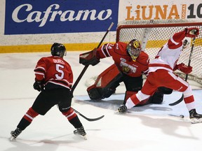 The Greyhounds' Boris Katchouk gathers the puck between his feet in front of goaltender Olivier Lafreniere shortly before opening the scoring in the first period of Game 4 between Owen Sound and Sault Ste. Marie at the Harry Lumley Bayshore Community Centre in Owen Sound. Greg Cowan/The Sun Times