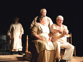 Photo by KEVIN McSHEFFREY/THE STANDARD
Myra and Angus Bennett (Kim Arnold and Jim Graham) and a patient (Dave Black), ride a horse-drawn sleigh, with another patient (Fran Perkins in the background. This was ELATE’s production of ‘Tempting Providence’ in the civic centre theatre. It won the Outstanding Production award at the QUONTA Drama Festival last month.