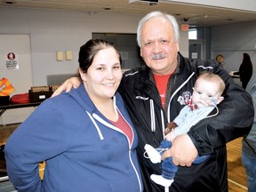 Photo by KEVIN McSHEFFREY/THE STANDARD
Baby Elijah Hennessey and his mother Jessie were with Howard Hennessey, the baby’s grandfather at the fundraiser at the Collins Hall on Saturday. Hundreds of people attended the event.