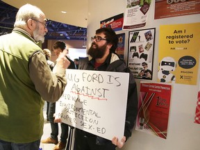 A Doug Ford supporter has a word with protestor Matt Charron at a Doug Ford rally in Sudbury on Wednesday. The Ontario PC leader is currently on a tour of Northern Ontario. Gino Donato/Sudbury Star/Postmedia Network