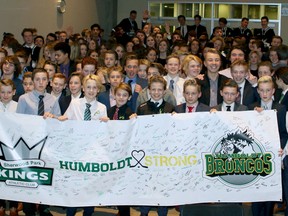 All 11 Sherwood Park Kings rep hockey teams signed and posed with a banner to support the victims and families of the Humboldt Bronocs bus disaster on Tuesday night. Photo courtesy Target Photography