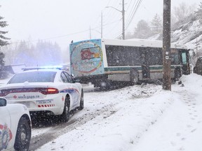 A city transit bus went through the guardrails and into the ditch on Ramsey Lake Road Thursday afternoon. Greater Sudbury Police said no injuries were reported but motorists could expect delays as emergency vehicles and a tow truck responded to the incident. (John Lappa/Sudbury Star)