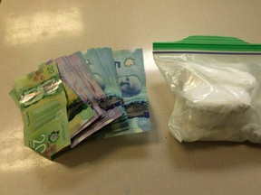 A Norfolk man is facing charges after cash and cocaine valued at $27,500 were found in a vehicle in Port Dover on Wednesday, April 11. A white pickup truck was also seized by police. Norfolk OPP photo