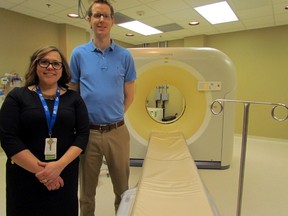 Franci Rogers, Sault Area Hospital manager of diagnostic imaging, and Dr. Brad Entwistle pose Thursday with the hospital’s new CT scan machine. JEFFREY OUGLER/SAULT STAR