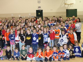 The students and staff at Amabel Sauble Community School in Sauble Beach wore their team jerseys for national jersey day today in support of those affected by the Humboldt Broncos tragedy. The Broncos, a junior hockey team from Humboldt, Saskatchewan, suffered the death of 16 people after their bus collided last Friday with a semi-trailer. Photo by Zoe Kessler/Wiarton Echo