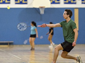 Jacob Coupland of Paris District Secondary School returns a shot during the Brant County high school senior badminton championship played on Thursday. (Brian Thompson/The Expositor)