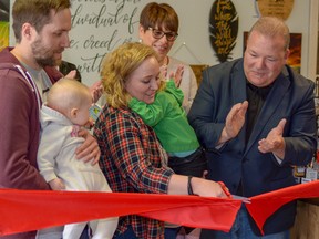 Lindsey Cybulskie, owner of Homegrown, cuts the ribbon with her husband John, daughters Carter and Maisyn, and Mayor Peter Brown at the grand opening of her business on April 4. Homegrown features unique Alberta-made products such as artisan foods, home decor, and handmade art.