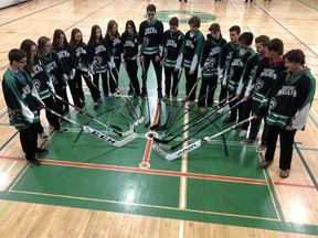 Staff and students from Ecole secondaire catholique l'Horizon, as well as many other local schools, rallied behind the Humbolt Broncos on Thursday, wearing jerseys or green-and-yellow shirts to school. Many schools also placed hockey sticks outside their school in solidarity with all those who were affected by the tragedy in Saskatchewan. Photo supplied