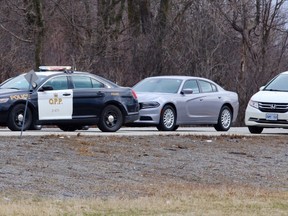 Ontario Provincial Police investigate the scene of a fatal hit and run on Highway 401 Friday, April 13, 2018. Ian MacAlpine, The Whig-Standard, Postmedia Network