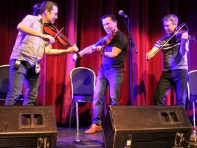 The Schryer Triplets, featuring brothers Pierre, Lewis and Daniel, perform during a soundcheck before their sold-out reunion show at The Tech on Friday.