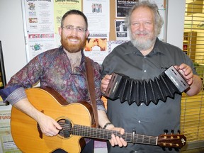 Canadian blues virtuoso Michael Schatte, left, and local folk musician Ian Bell lent their musical talents to a Peace Poetry event at the Port Dover branch of the Norfolk public library Thursday. MONTE SONNENBERG / SIMCOE REFORMER